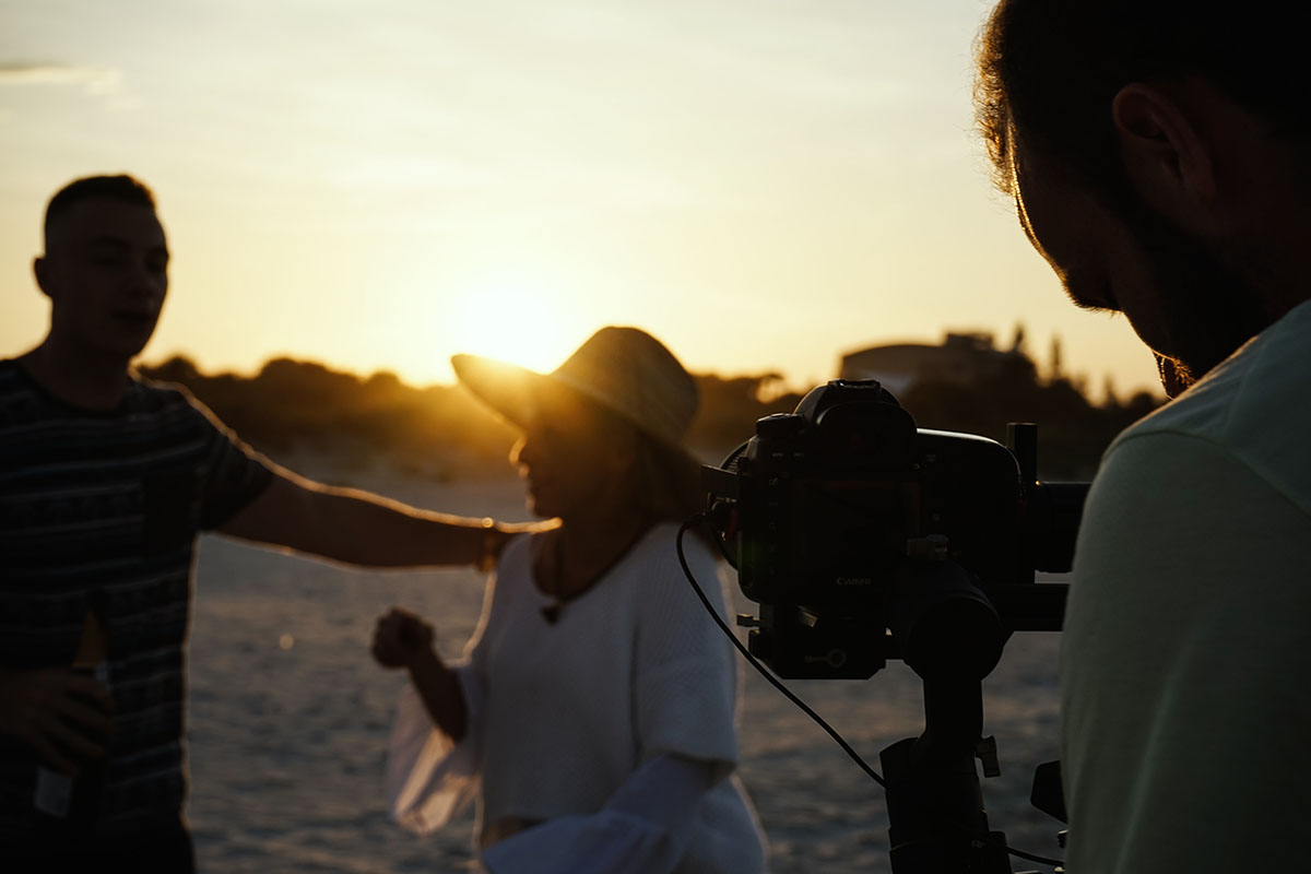 Filmming actors at sunset